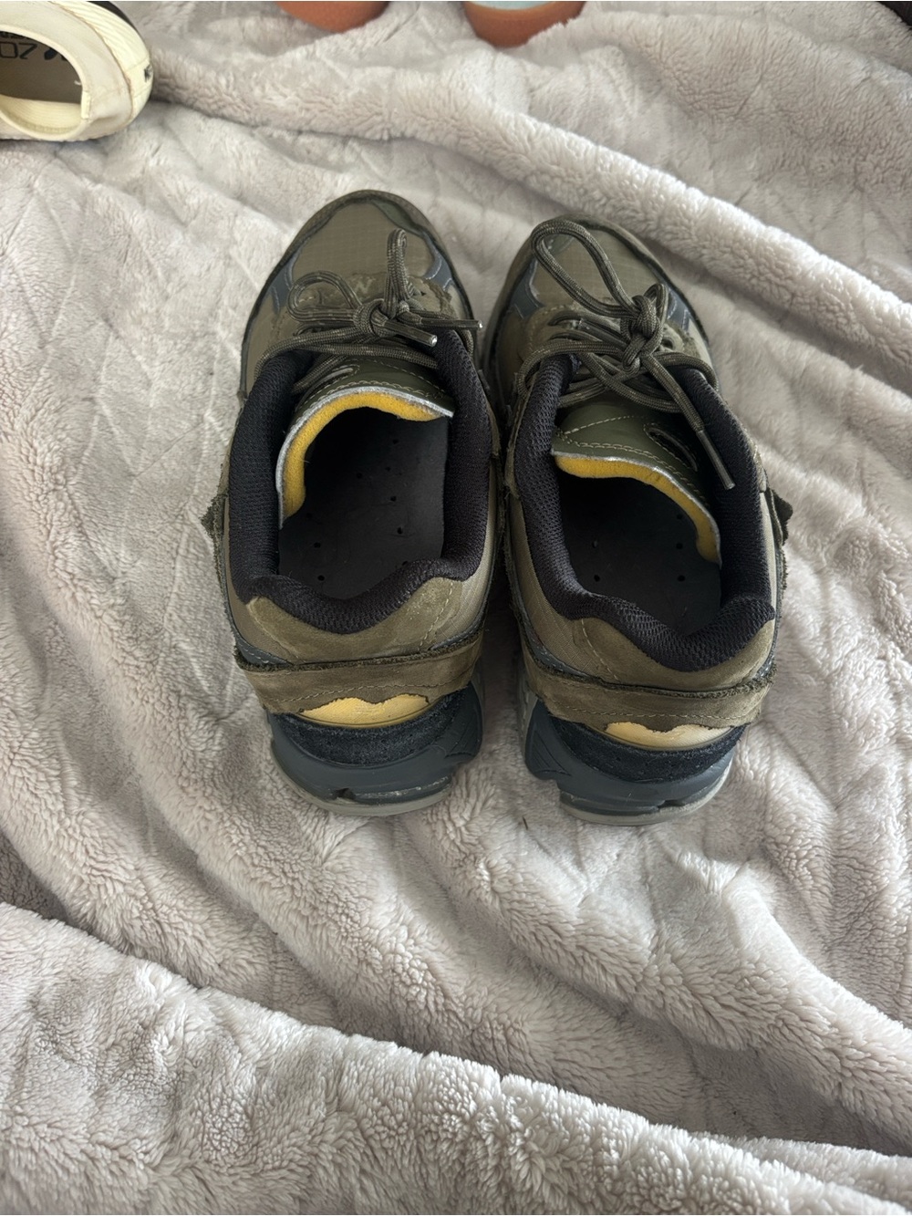 New Balance Olive Green and Black Men's Athletic Sneakers with Yellow Accents